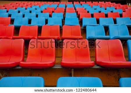 stadium seats, red and blue seat on stadium steps bleacher