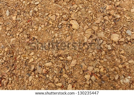 soil texture, brown ground soil texture mixed with small rocks