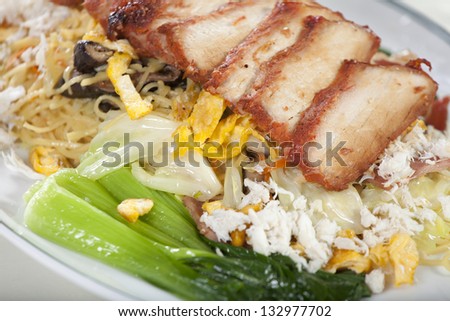 roasted pork noodle, red roasted pork with crab fried noodle with vegetable decorated