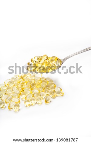 yellow vitamin tablets, transparent yellow vitamin tablets with teaspoon
