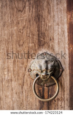 metal door knocker, Asia Thai style metal lion door knocker on wooden door