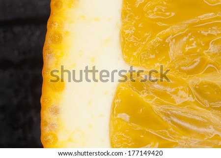 cut orange, close-up macro of cut orange showing skin and pulp