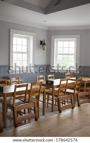 restaurant, empty wood table set decorated in restaurant dining room