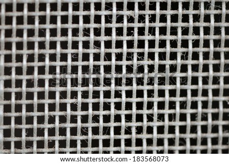 window screen, close-up to texture surface of wire window screen with tiny dust