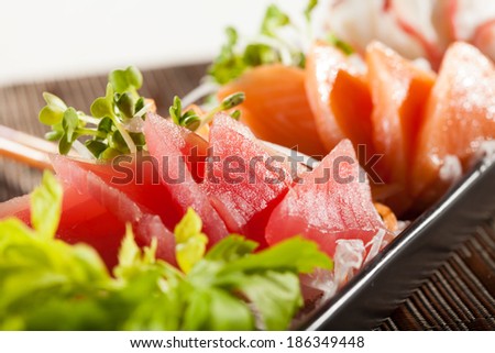 sashimi, raw fish mixed in traditional Japanese style eat with slice daikon radish