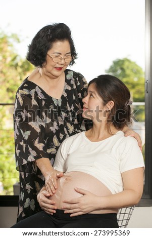 generations, Asian Grandmother smile take care of her pregnancy daughter