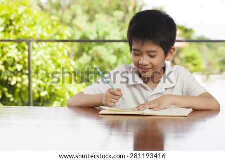 kid life, an Asian boy activity playing game, do homework, spending spare time