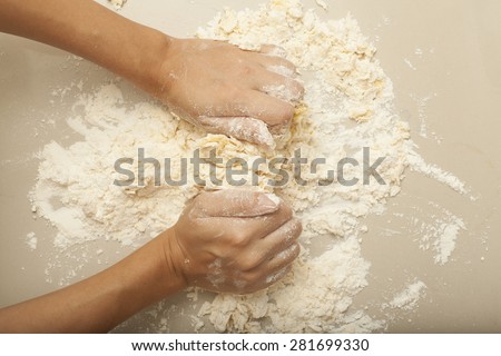 Pasta Homemade, a female hand threshing flour making pasta homemade
