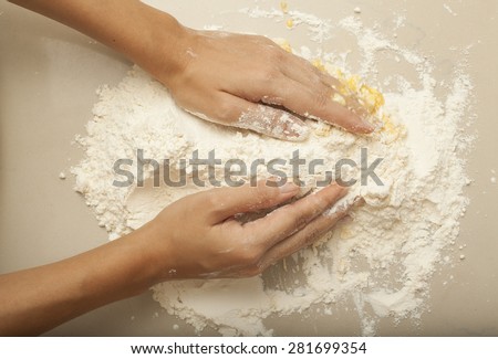 Pasta Homemade, a female hand threshing flour making pasta homemade
