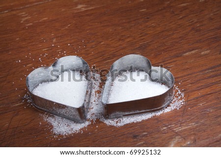 Sweet hearts, Two silver heart shape adding sugar.