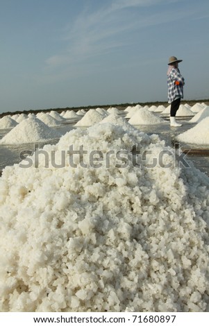 Salt texture with farmer, salt pile in Thailand, salt pan.
