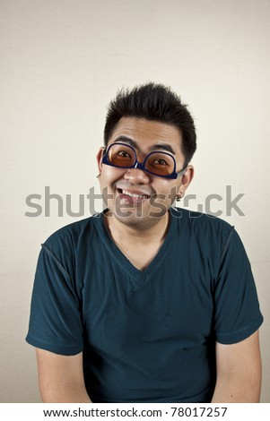 upside down, A man wearing eyeglass upside down, funny face.