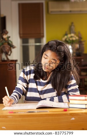 studying, a girl writing on a lesson book, study.