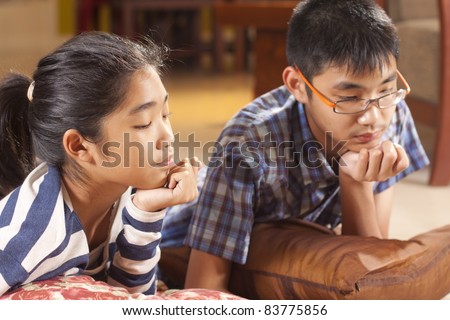 pay attention, brother and sister paying attention to study.