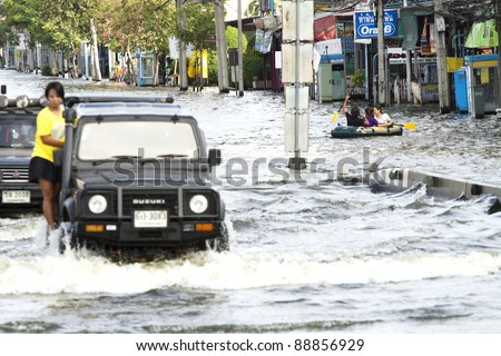 BANGKOK, THAILAND - NOV 12: Commuter transported on the big truck only after the city was flooded on November 12, 2011 in Bangkok, Thailand.