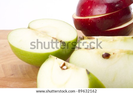 ready to diet, red and green apple cut and put on wood plate.