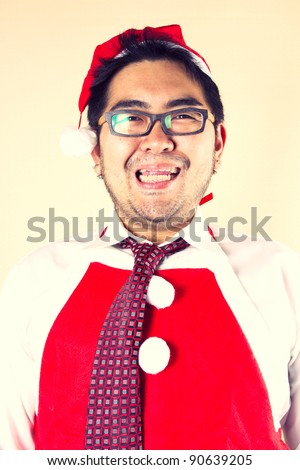 Santa apron, Businessman wear Santa red tie, red apron, red hat smiling.