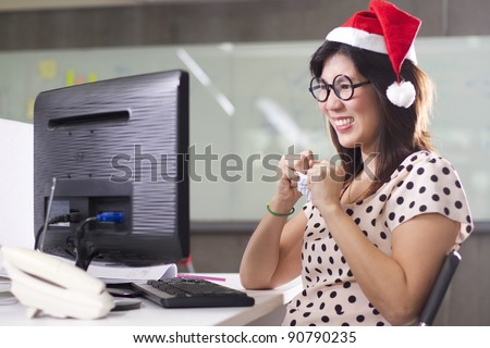 office girl angry, a secretary working wear Santa red hat  crushing paper angry.