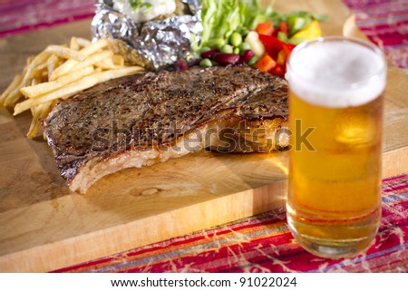 football time, set of beef steak and beer on the table
