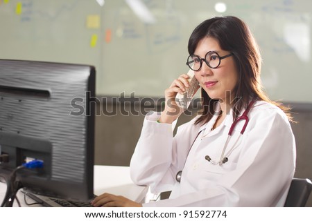 doctor appointment, Asian female doctor on the phone.