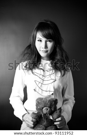 bear and girl, female model pose psycho act with teddy bear.