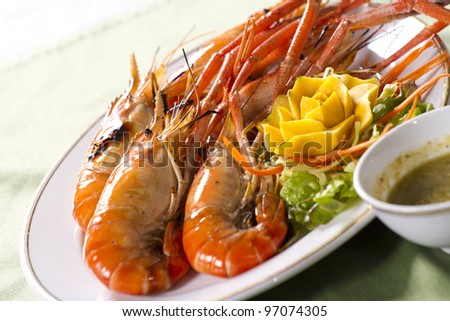 grilled prawns dish, orange grilled prawn with sour sauce in a dish