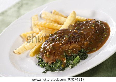 beef steak, beef steak with brown sauce spinach and french fries