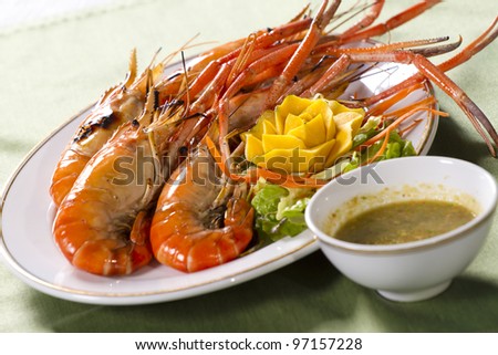 grilled prawns dish, orange grilled prawn with sour sauce in a dish