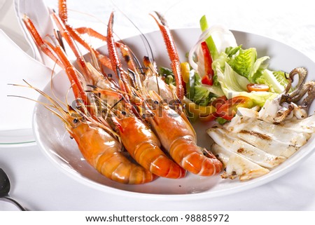 prawns, orange grilled prawn with sour sauce in a dish