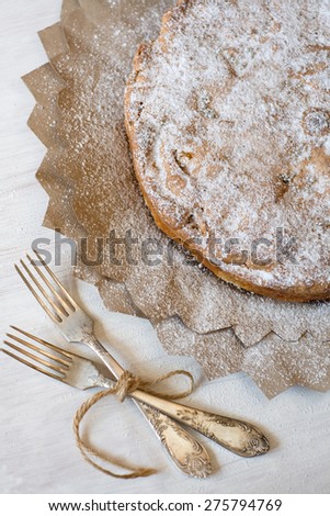 Delicious apple pie for lying on wooden painted background.