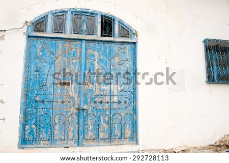 Locked Wooden Front Door of the Old House with Big Lock in Mahdia, Tunisia