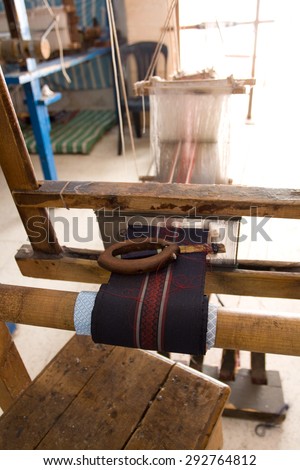 Authentic weaving machine, which weave patterns on fabric Tunisian weavers. Mahdia. Tunisia. Africa.