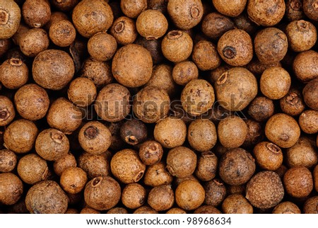 Background texture of whole allspice(jamaica pepper)  Used as a spice in cuisines all over the world. Also used in medicine.