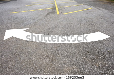 Arrow turn right on street with empty Space in a parking lot