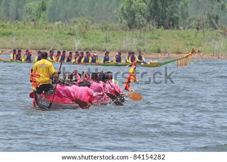 RATCHABURI,THAILAND  - SEPT 3: Traditional Thai Long Boats with a crew of 30 waiting time for match during Queen Cup Traditional Long Boat Race Championship on Sept. 3, 2011 in Ratchaburi, Thailand