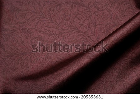 Elegant brown satin background with floral print.