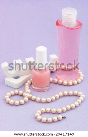 Various accessories including a nail polish and hand lotion