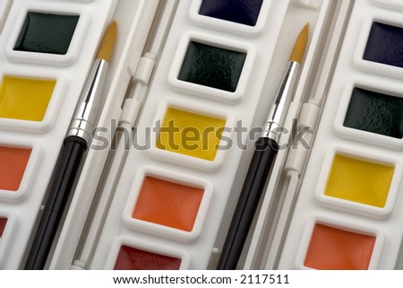 An array of paint sets in order and ready to create art.