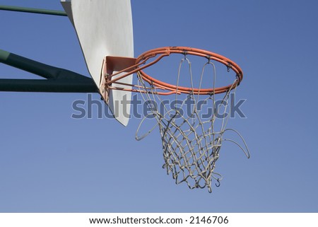 a basketball net that has seen better days from many games of use.