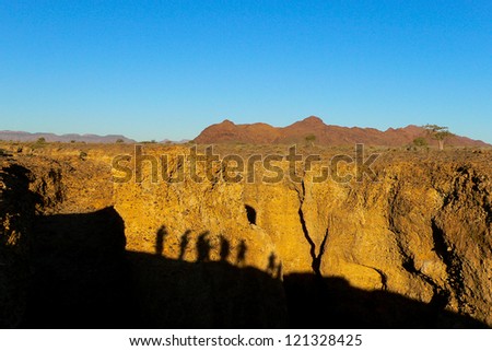 Human Shadow on the Rocks in the Namib Desert