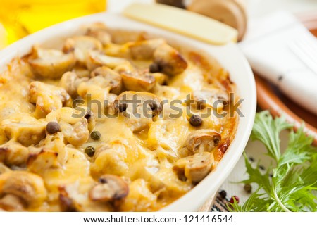 Vegetables Pie with mushrooms, potatoes and cheese closeup. Healthy and nutritious eating