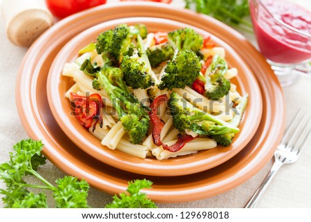 Pasta with roasted vegetables broccoli and pepper. Italian food