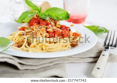 Nutritional spaghetti with tomato sauce on a plate. Italian food
