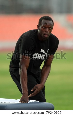 THESSALONIKI, GREECE -SEPTEMBER 11:Jamaican U.Bolt stretching in the training center for the IAAF World Athletics Finals main event in Kaftatzoglio Stadium on September 11, 2009 in Thessaloniki,Greece