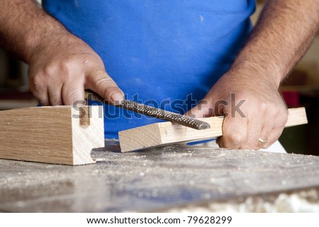 carpenter hands scratching and cutting