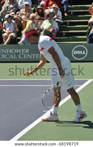 INDIAN WELLS, CALIFORNIA - March 14.  Spain's Rafael Nadal prepares to serve during an early round doubles match March 14, 2010 at the BNP Paribas Open.