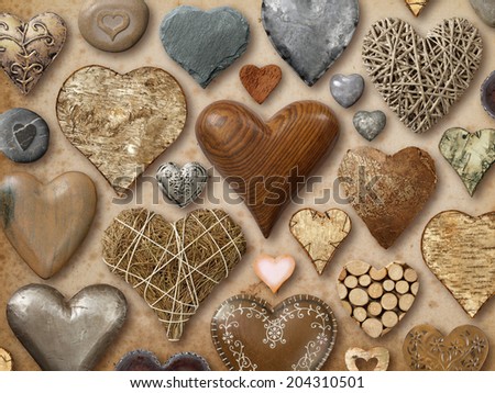 Background of heart-shaped things made of stone, metal and wood.