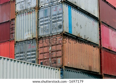 Shipping containers waiting to be loaded on a cargo ship.