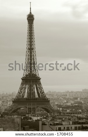 Sepia image of the Eiffel Tower on a gloomy day in Paris.