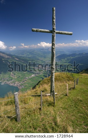 A wooden cross standing on top of Rigi mountain in Switzerland.